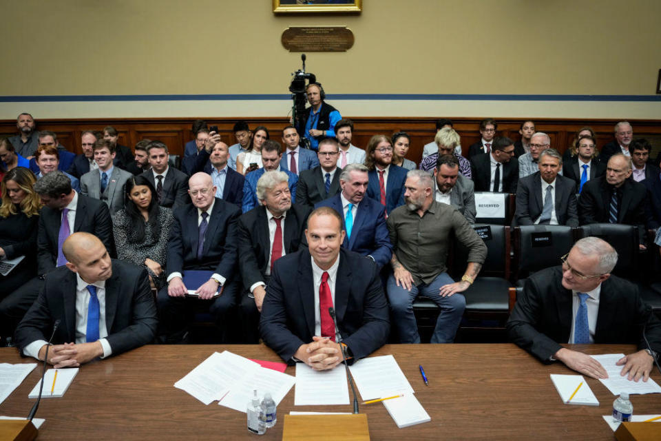 From left, Ryan Graves, David Grusch and David Fravor take their seats as they arrive for a House subcommittee hearing on unidentified anomalous phenomena on July 26, 2023. / Credit: Drew Angerer / Getty Images