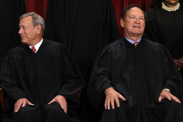 United States Supreme Court Chief Justice John Roberts (L) and Associate Justice Samuel Alito (R) pose for an official portrait at the East Conference Room of the Supreme Court building on October 7, 2022, in Washington, D.C. The Supreme Court has begun a new term after Associate Justice Ketanji Brown Jackson was officially added to the bench in September.