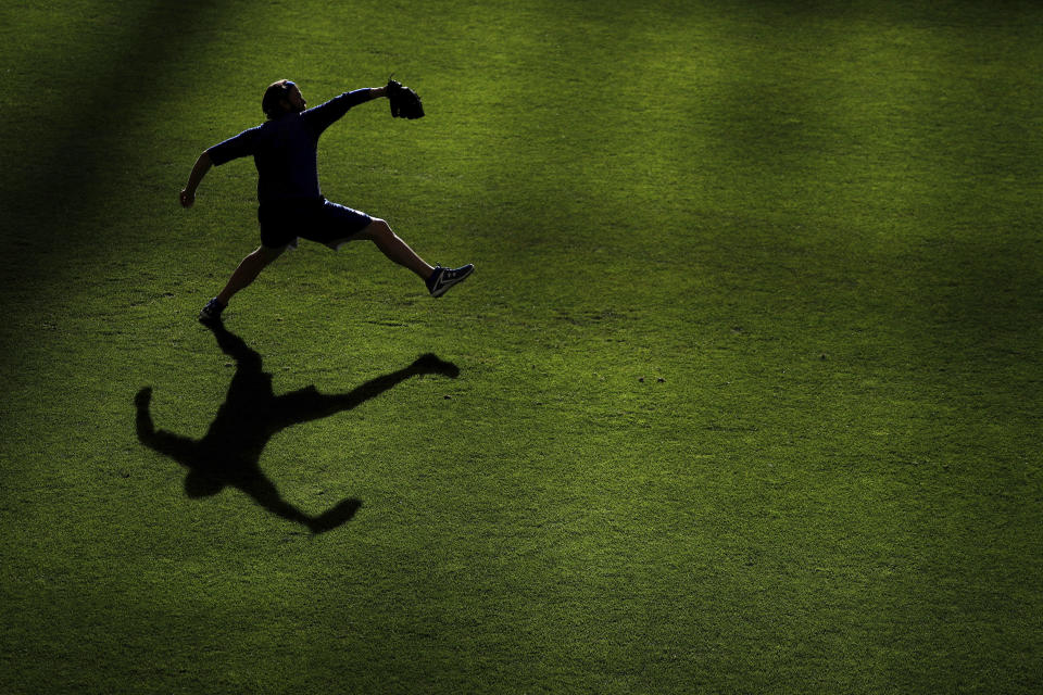 Los Angeles Dodgers' Clayton Kershaw warms up before Game 7 of the National League Championship Series baseball game against the Milwaukee Brewers Saturday, Oct. 20, 2018, in Milwaukee. (AP Photo/Charlie Riedel)