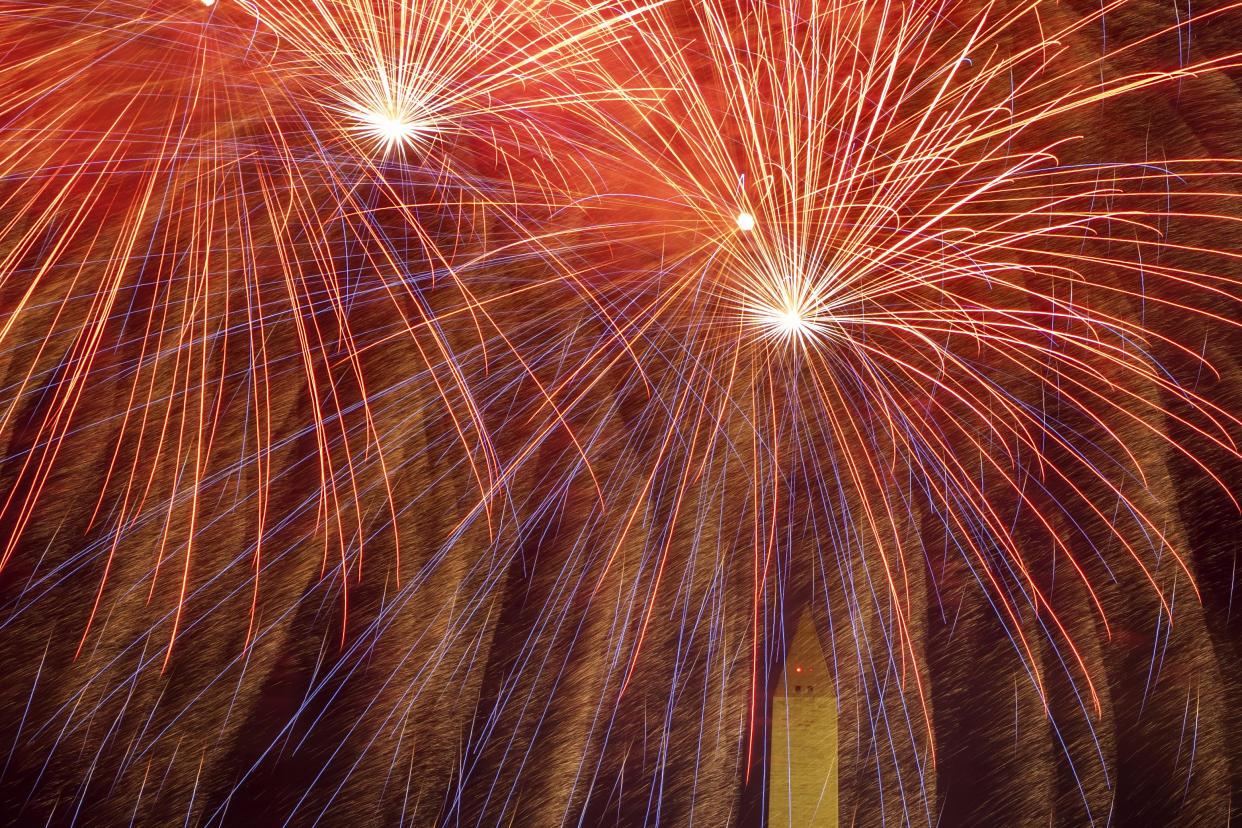 Fireworks burst above the the Washington Monument.