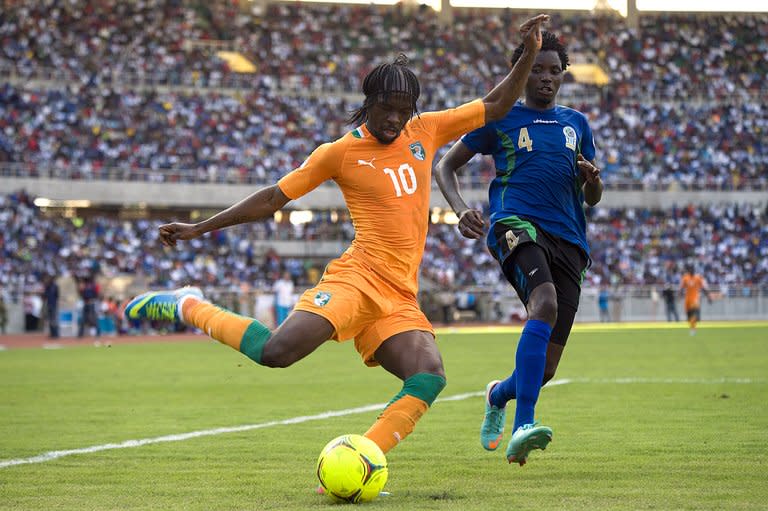 Gervais Kouassi Gervinho (L) of Ivory Coast dribbles the ball against Erasto Nyoni of Tanzania on June 16, 2013 during their 2014 World Cup qualifying match in the Tanzanian capital Dar es Salaam. Egypt, Ethiopia and Ivory Coast Sunday became the first countries to reach the play-offs in the Africa zone of the 2014 World Cup qualifiers