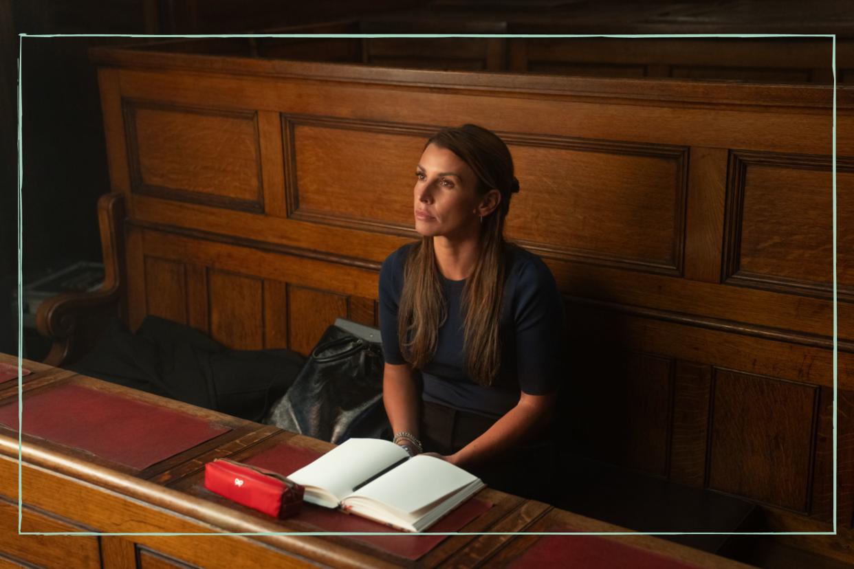  Coleen Rooney sat on a witness stand in a courtroom. 