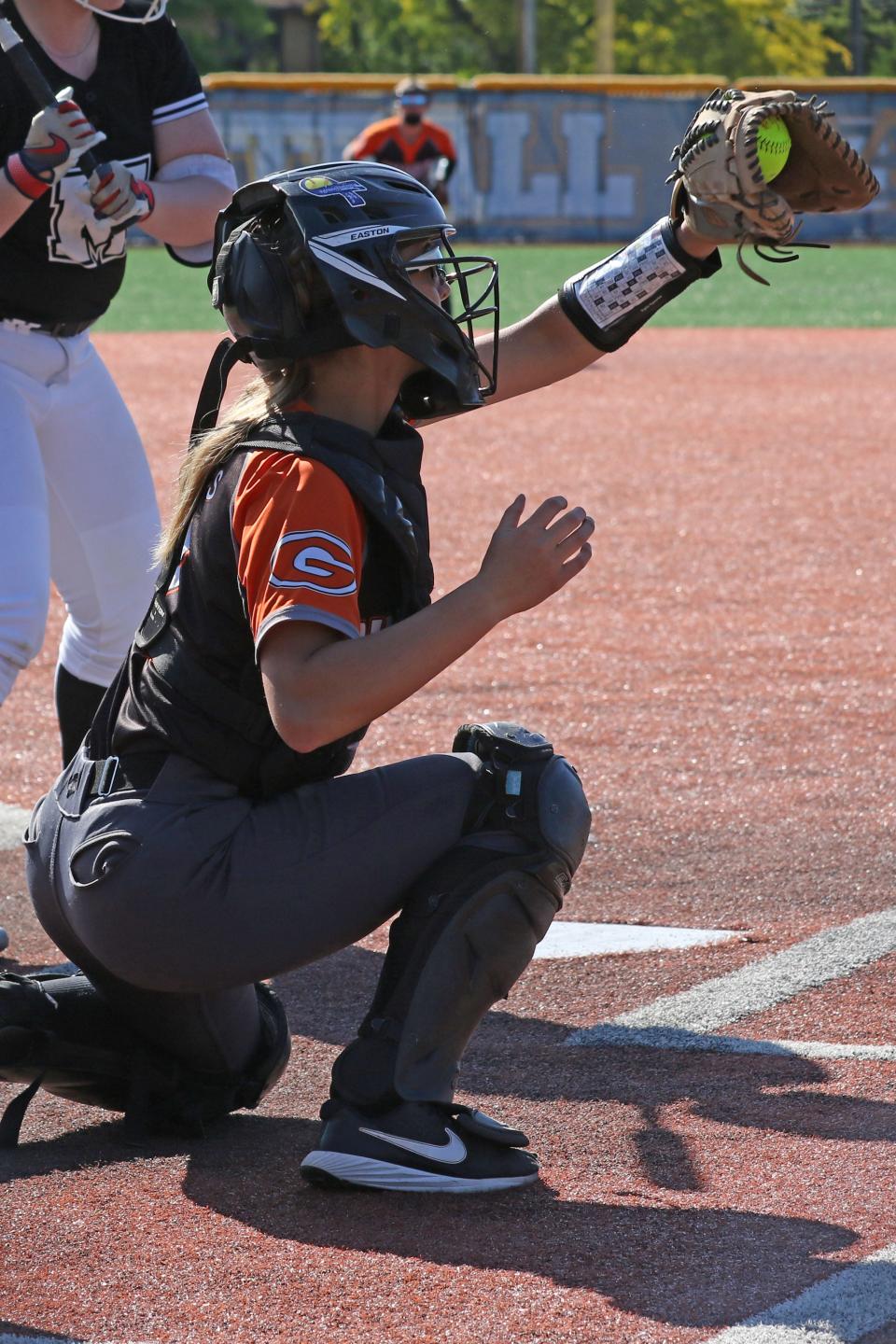 Gibsonburg's Cheyenne Reese snags a high pitch.