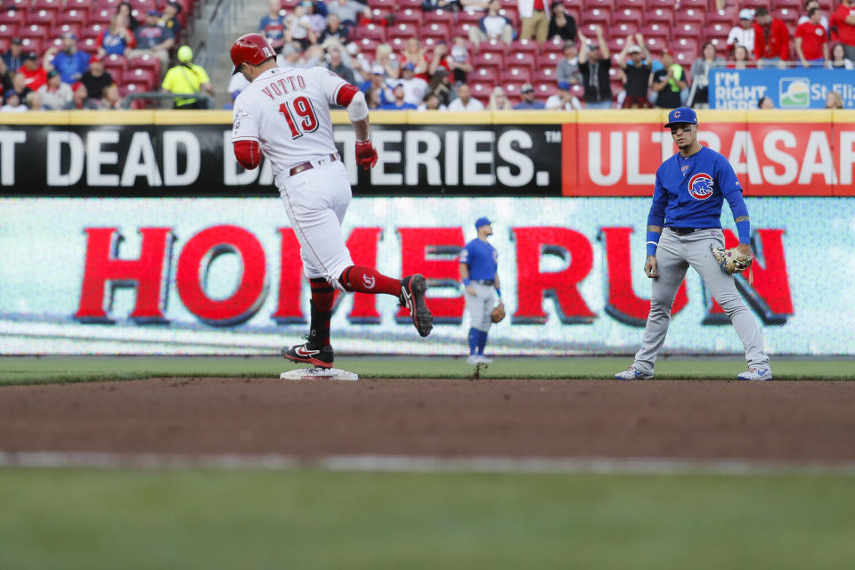 Cincinnati Reds' Joey Votto runs the bases after hitting a solo home run off Chicago Cubs starting pitcher Kyle Hendricks during the fourth inning of a baseball game Tuesday, May 14, 2019, in Cincinnati. (AP Photo/John Minchillo)