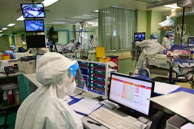 A view shows members of the medical staff at work in the Covid-19 intensive care unit (ICU) of the Bolognini hospital in Seriate, Bergamo, on March 12, 2021, amid the Covid-19 (novel coronavirus) pandemic. - At the Seriate hospital, near Bergamo, the intensive care unit is once again full, its eight beds occupied by coronavirus patients, even if the numbers are not as high as last year. 