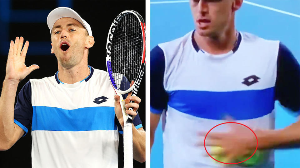 John Millman looks surprised and is also seen rubbing the tennis balls against his shirt.