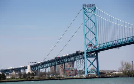 Semi trucks heading for Windsor, Ontario, are seen crossing Ambassador Bridge from Detroit, Michigan, in Windsor, Ontario, Canada, April 28, 2017. REUTERS/Rebecca Cook