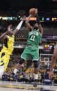 Boston Celtics guard Kyrie Irving (11) shoots over Indiana Pacers guard Darren Collison (2) during the first half of Game 4 of an NBA basketball first-round playoff series in Indianapolis, Sunday, April 21, 2019. (AP Photo/Michael Conroy)