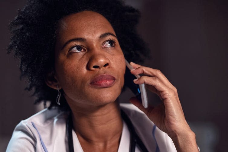 <span class="caption">Finding the right words.</span> <span class="attribution"><a class="link " href="https://www.shutterstock.com/image-photo/close-portrait-black-doctor-making-phone-1311344714" rel="nofollow noopener" target="_blank" data-ylk="slk:Shutter stock/Drazen Zigic;elm:context_link;itc:0;sec:content-canvas">Shutter stock/Drazen Zigic</a></span>