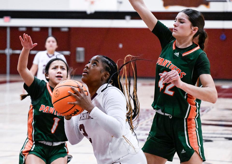 Mt. Whitney's Laneyha Thomas looks to shoot against Porterville in an East Yosemite League high school girls basketball game Tuesday, January 9, 2024.
