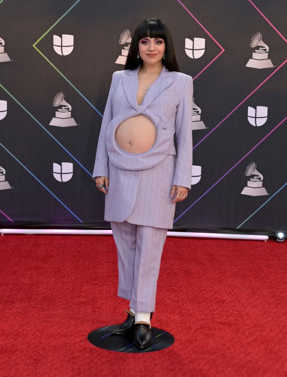 <p>Chilean singer Mon Laferte presented the world with her take on maternity red carpet fashion by wearing a lilac suit featuring a hole that completely exposed her baby bump. The bold styling was a hit with her fans, with one writing on social media: "Loved Mon Laferte's baby bump reveal. Flawless queen". (Getty Images)</p> 