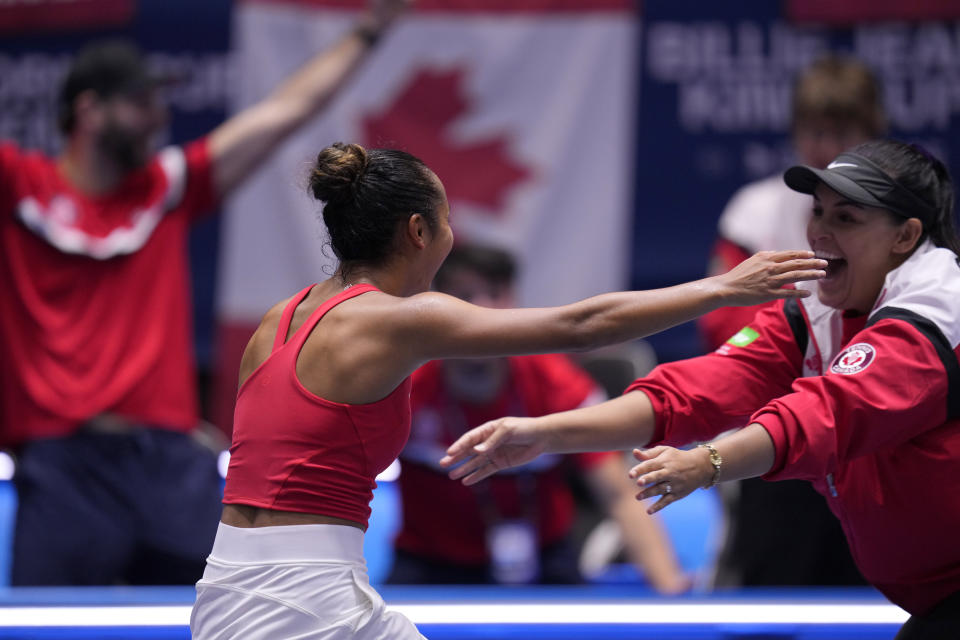 Canada's Leylah Fernandez celebrates after wining against Italy's Jasmine Paolini during their final singles tennis match at the Billie Jean King Cup finals at La Cartuja stadium in Seville, southern Spain, Spain, Sunday, Nov. 12, 2023. (AP Photo/Manu Fernandez)