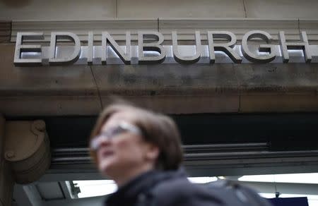 A woman leaves the Edinburgh Waverley train station in Edinburgh, Scotland May 1, 2014. REUTERS/Suzanne Plunkett