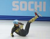 Japan's Satoshi Sakashita crashes out in the men's 500 metres short track speed skating quarterfinal event at the Iceberg Skating Palace during the 2014 Sochi Winter Olympics February 21, 2014. REUTERS/Marko Djurica (RUSSIA - Tags: OLYMPICS SPORT SPEED SKATING)