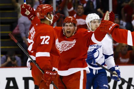 Apr 17, 2016; Detroit, MI, USA; Detroit Red Wings center Andreas Athanasiou (72) celebrates with center Joakim Andersson (18) after scoring a goal during the second period against the Tampa Bay Lightning in game three of the first round of the 2016 Stanley Cup Playoffs at Joe Louis Arena. Mandatory Credit: Rick Osentoski-USA TODAY Sports / Reuters Picture Supplied by Action Images