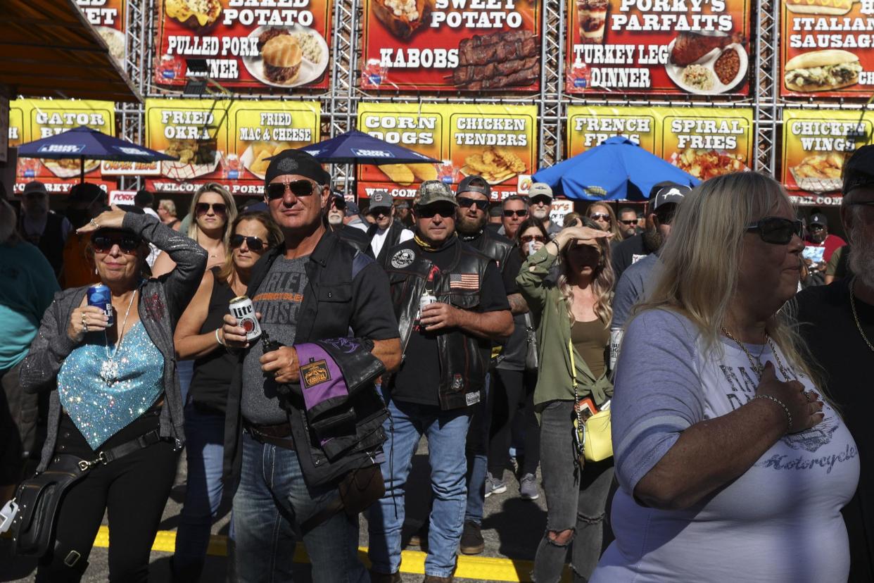 People watch live music in The Lot at Full Moon Saloon in Daytona, FL during the start of Bike Week on March 5, 2021. (Sam Thomas/Orlando Sentinel)