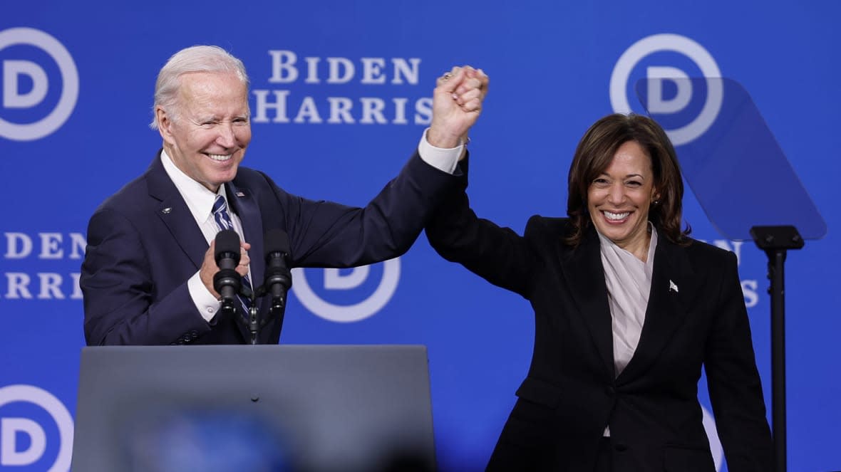 President Joe Biden and Vice President Kamala Harris join hands on Feb. 3, 2023 after speaking at the Democratic National Committee winter meeting in Philadelphia. (Photo by Anna Moneymaker/Getty Images)