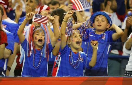 Jun 30, 2015; Montreal, Quebec, CAN; United States fans cheer after the semifinals game against Germany in the FIFA 2015 Women's World Cup at Olympic Stadium. United States defeated Germany 2-0. Mandatory Credit: Jean-Yves Ahern-USA TODAY Sports