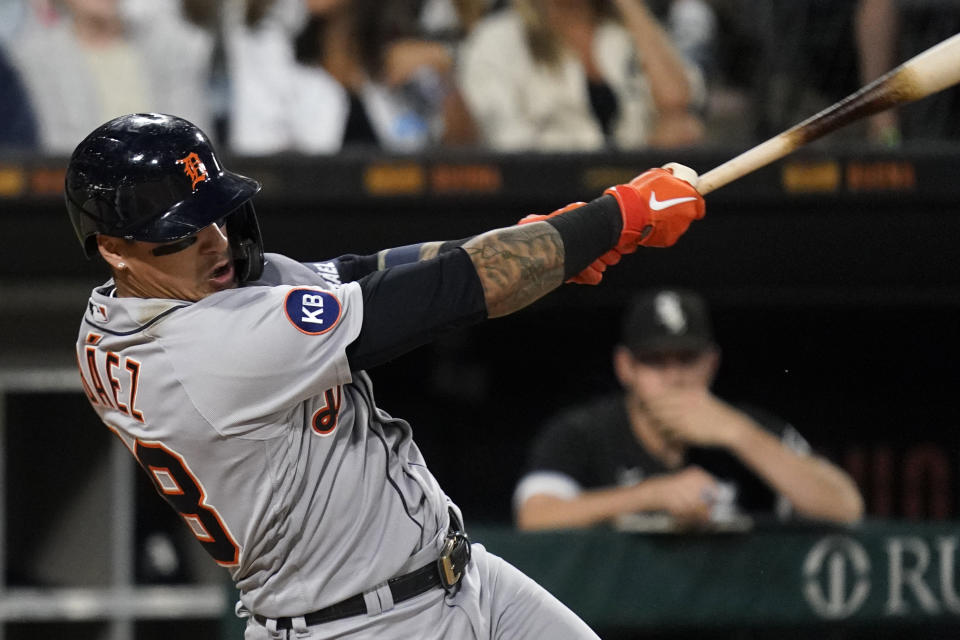 Detroit Tigers' Javier Baez hits a single during the seventh inning of a baseball game against the Chicago White Sox in Chicago, Friday, Aug. 12, 2022. (AP Photo/Nam Y. Huh)