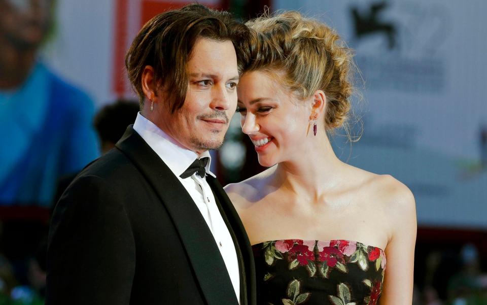 Actors Johnny Depp and Amber Heard went through a bitter divorce earlier this year  - AP