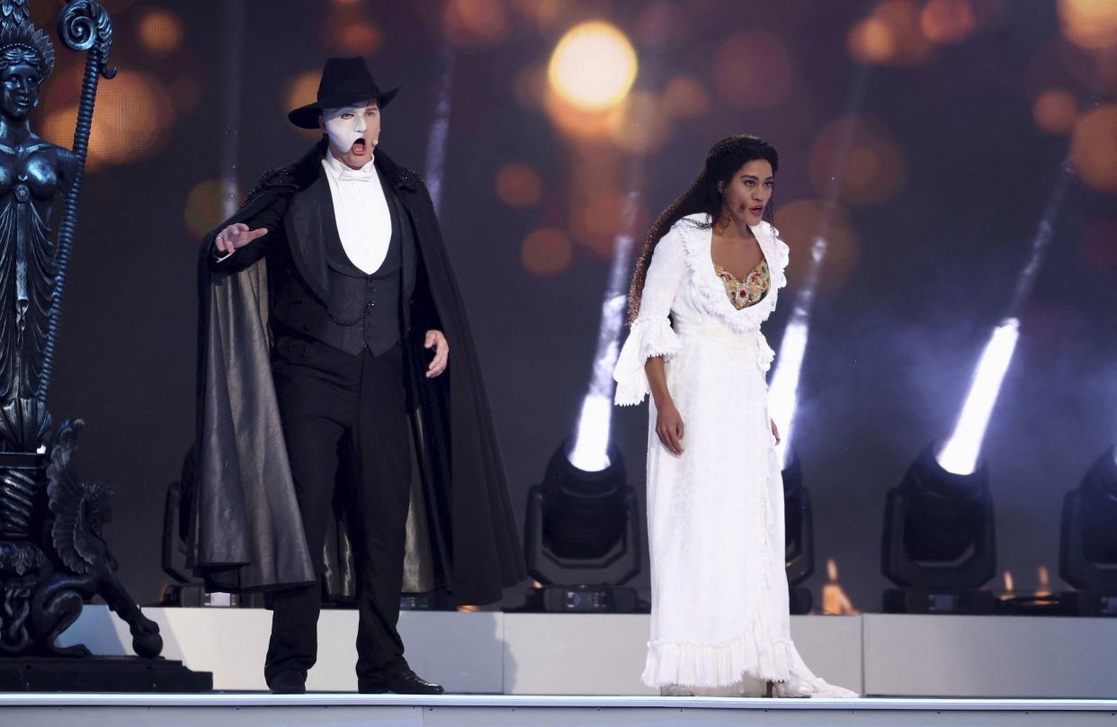 Actors from the musical Phantom of the Opera perform at the Platinum Jubilee concert in front of Buckingham Palace in London on Saturday, June 4, 2022, on the third of four days of celebrations to mark the Platinum Jubilee.