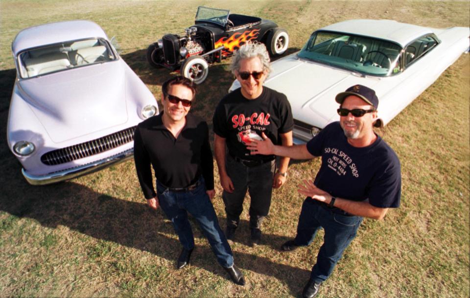From left, close friends Jimmie Vaughan, Continental Club owner Steve Wertheimer and Chuy's co-founder Mike Young, seen in 1999, shared a deep love of classic cars.