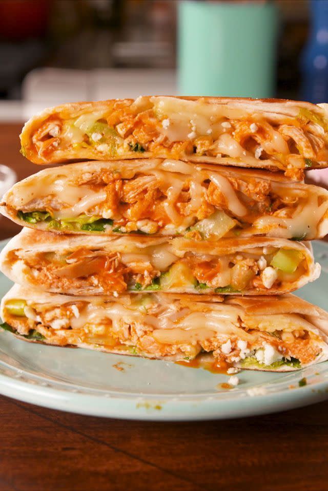 <p>We love <a href="https://www.delish.com/cooking/recipe-ideas/recipes/a52078/crunchwrap-supreme-recipe/" rel="nofollow noopener" target="_blank" data-ylk="slk:crunchwrap supremes;elm:context_link;itc:0;sec:content-canvas" class="link ">crunchwrap supremes</a> and <a href="https://www.delish.com/cooking/recipe-ideas/recipes/a51133/classic-buffalo-wings-recipe/" rel="nofollow noopener" target="_blank" data-ylk="slk:buffalo chicken wings;elm:context_link;itc:0;sec:content-canvas" class="link ">buffalo chicken wings</a> so it only made sense to combine them. This is one of our absolute favorite takes on <a href="https://www.delish.com/cooking/g516/buffalo-chicken-recipes/" rel="nofollow noopener" target="_blank" data-ylk="slk:buffalo chicken;elm:context_link;itc:0;sec:content-canvas" class="link ">buffalo chicken</a>, and we have a strong feeling you're going to love it too.</p><p>Get the <strong><a href="https://www.delish.com/cooking/recipe-ideas/recipes/a58636/buffalo-chicken-crunchwrap-recipe/" rel="nofollow noopener" target="_blank" data-ylk="slk:Buffalo Chicken Crunchwrap recipe;elm:context_link;itc:0;sec:content-canvas" class="link ">Buffalo Chicken Crunchwrap recipe</a></strong>.</p>