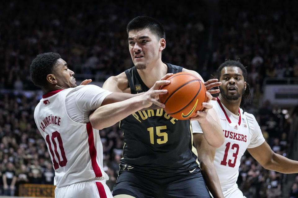 Purdue center Zach Edey (15) is fouled by Nebraska guard Jamarques Lawrence (10) during the second half of an NCAA college basketball game in West Lafayette, Ind., Friday, Jan. 13, 2023. Purdue defeated Nebraska 73-55. (AP Photo/Michael Conroy)