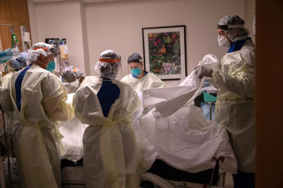 A ‘prone team’, wearing personal protective equipment (PPE), turns over a patient with Covid-19 in Stamford, Connecticut.