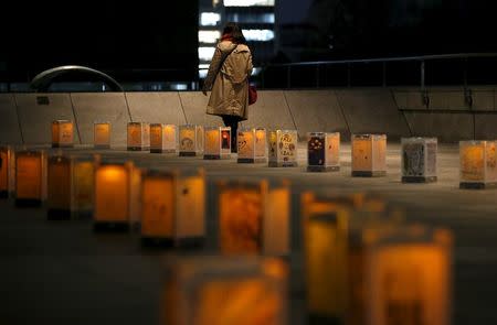 Lanterns from northern Japanese city Natori are illuminated during an event to pray for the reconstruction of areas devastated by the March 11, 2011 earthquake and tsunami, and mourn victims of the disaster at the Canadian embassy in Tokyo, Japan, March 10, 2016, a day before the five-year anniversary of the disaster. REUTERS/Issei Kato