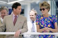 <p>A younger Charles wore the ring with a matching gold watch, while Princess Diana sported her trusty watch and hoop combo while the couple were in Seville, Spain in May 1992. </p>