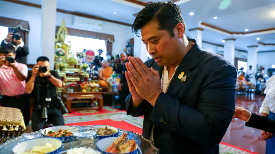 Vacharaesorn Vivacharawongse prays during a religious ceremony at Wat Yannawa temple in Bangkok, Thailand, August 10. - Athit Perawongmetha/Reuters