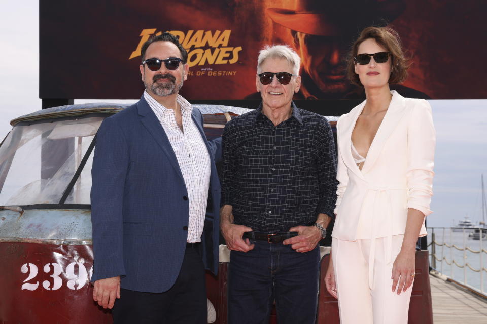 Director James Mangold, from left, Harrison Ford, and Phoebe Waller-Bridge pose for photographers at the photo call for the film 'Indiana Jones and the Dial of Destiny' at the 76th international film festival, Cannes, southern France, Thursday, May 18, 2023. (Photo by Vianney Le Caer/Invision/AP)