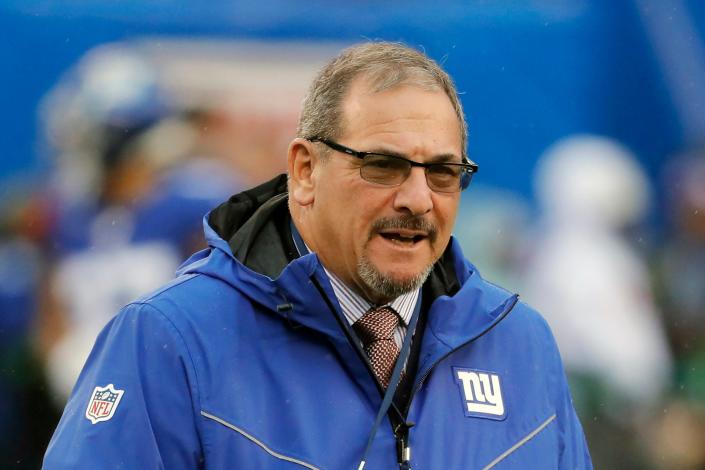 FILE - New York Giants general manager Dave Gettleman watches warm ups before an NFL football game against the Philadelphia Eagles in East Rutherford, N.J., in this Sunday, Dec. 29, 2019, file photo. While sick of the losing seasons, co-owner John Mara felt the New York Giants established a foundation and culture under rookie coach Joe Judge, giving him optimism the playoffs may not be far away. Mara also disclosed Wednesday, Jan. 6, 2021, 69-year-old Dave Gettleman would be back for a fourth season. (AP Photo/Seth Wenig, File)