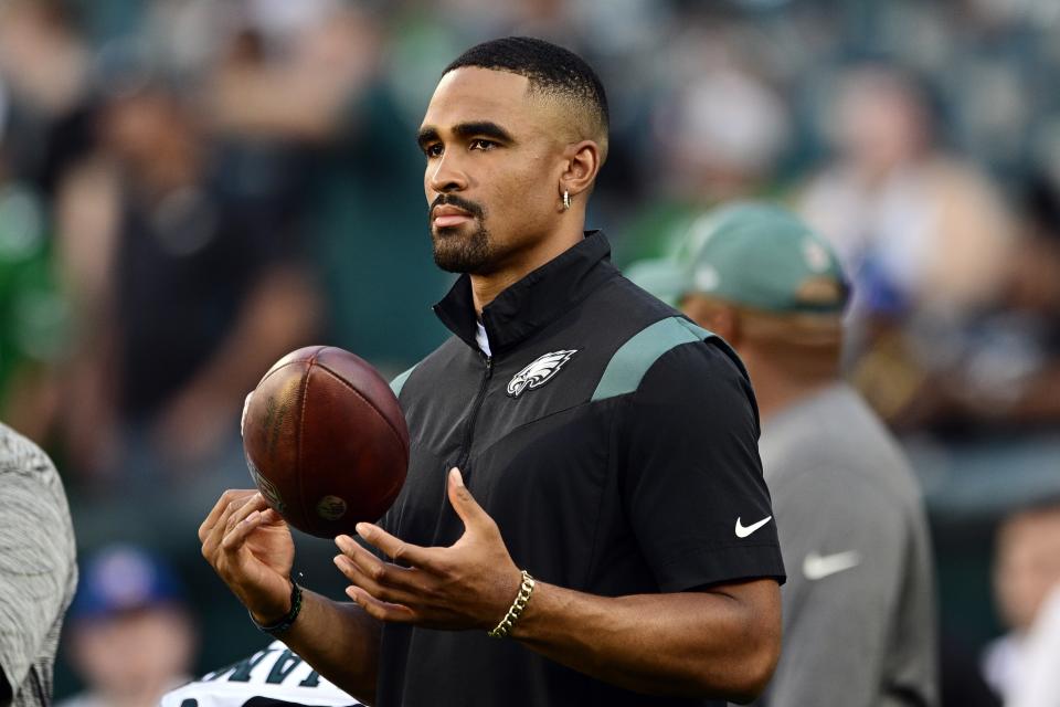 Philadelphia Eagles quarterback Jalen Hurts watches warm ups before an NFL preseason football game against the Cleveland Browns on Thursday, Aug. 17, 2023, in Philadelphia. (AP Photo/Derik Hamilton)