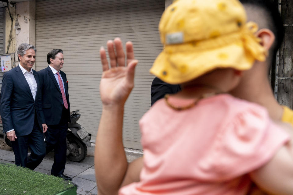 U.S. Secretary of State Antony Blinken, accompanied by Ambassador of the United States to Vietnam Marc Knapper, second from left, walks to Binh Minh Jazz Club in Hanoi, Vietnam, Saturday, April 15, 2023. (AP Photo/Andrew Harnik, Pool)