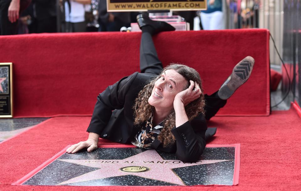 Entertainer "Weird Al" Yankovic strikes a pose at the ceremony honoring him with the 2,643rd star on the Hollywood Walk of Fame.