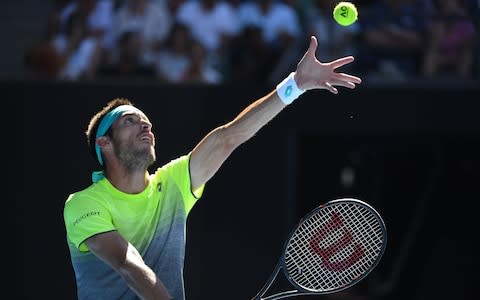 Argentina's Leonardo Mayer serves against Spain's Rafael Nadal during their men's singles second round match on day three of the Australian Open tennis tournament in Melbourne on January 17, 2018 - Credit: AFP