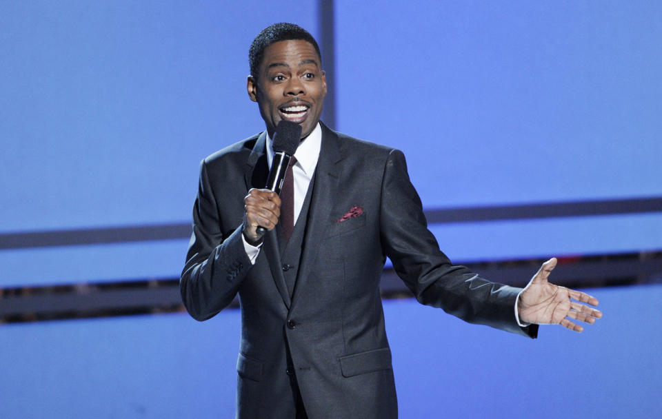 Host Chris Rock speaks on stage at the BET Awards at the Nokia Theatre on Sunday, June 29, 2014, in Los Angeles. (Photo by Chris Pizzello/Invision/AP)