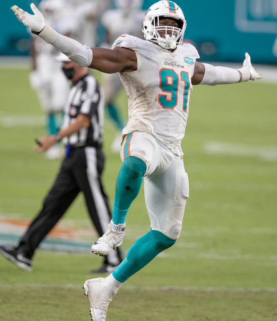 Miami Dolphins defensive end Emmanuel Ogbah (91) celebrates a sack of New York Jets quarterback Joe Flacco (5) at Hard Rock Stadium in Miami Gardens, October 18, 2020.  [ALLEN EYESTONE/The Palm Beach Post]