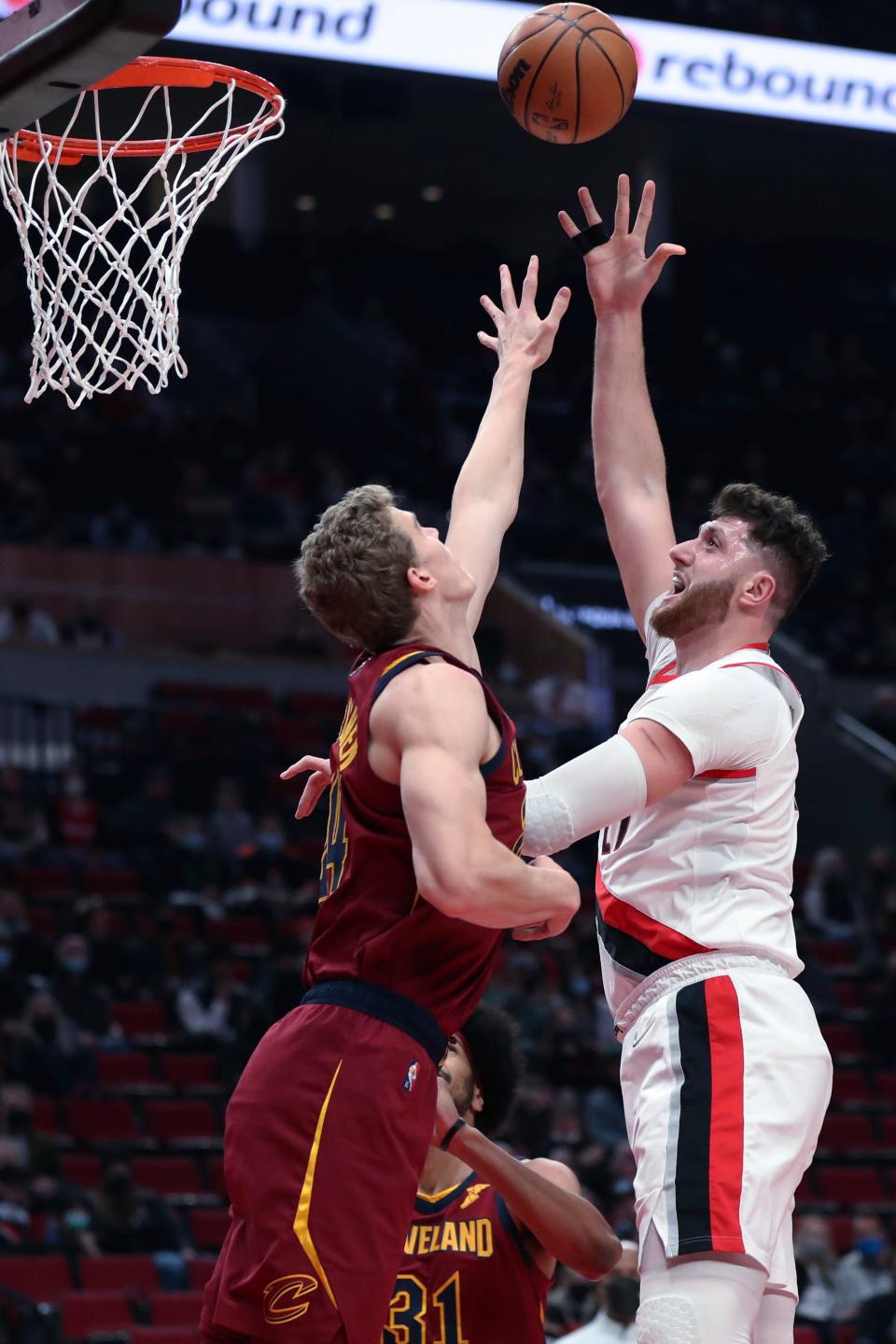 Portland Trail Blazers center Jusuf Nurkic shoots over Cleveland Cavaliers forward Lauri Markkanen during the first half of an NBA basketball game in Portland, Ore., Friday, Jan. 7, 2022. (AP Photo/Amanda Loman)