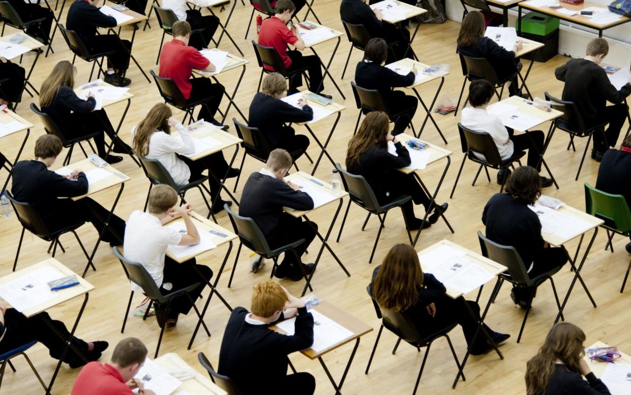 Secondary school students sitting their GCSE examinations - Rex Features