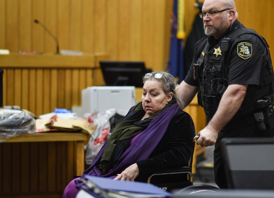 A bailiff with the Eaton County Sheriff's Dept. wheels Beverly McCallum, 63, from the stand following her testimony in Judge Janice Cunningham's Eaton County courtroom in Charlotte, Friday, March 29, 2024.