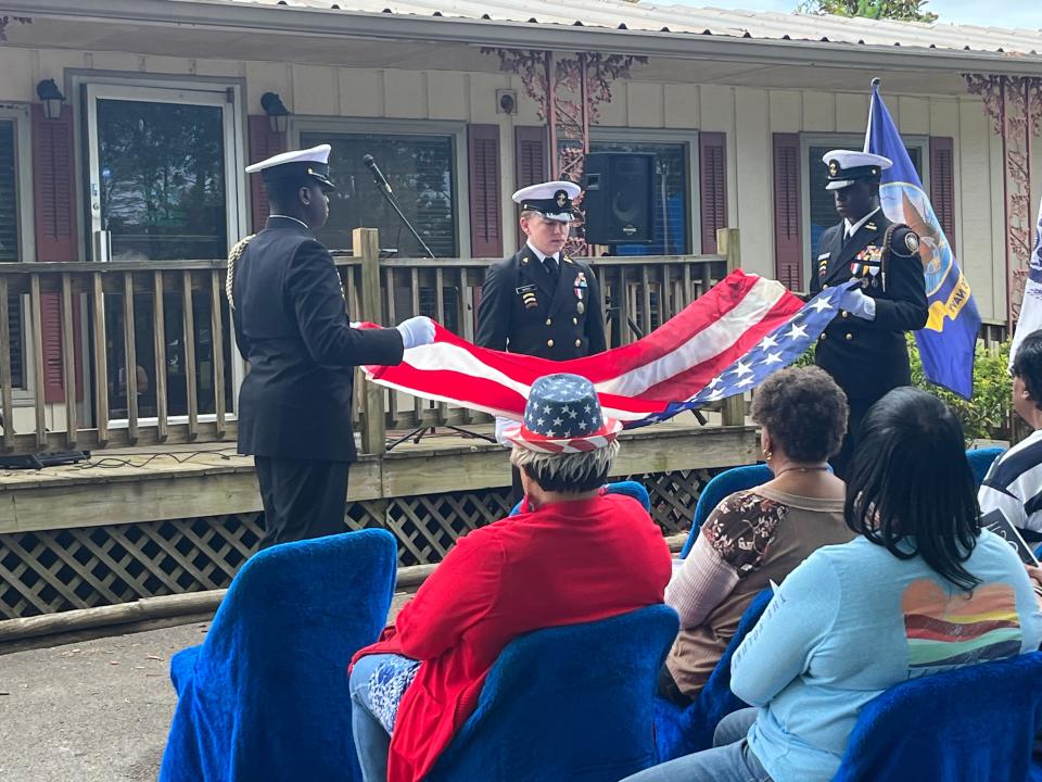 Columbia Central High School JROTC members Tre Martin, Joey March and Keve Martin fold the American flag to honor fallen heroes at the Memorial Day program at Pinecrest Memorial Gardens in Columbia, Tenn. on Monday, May 29, 2023.