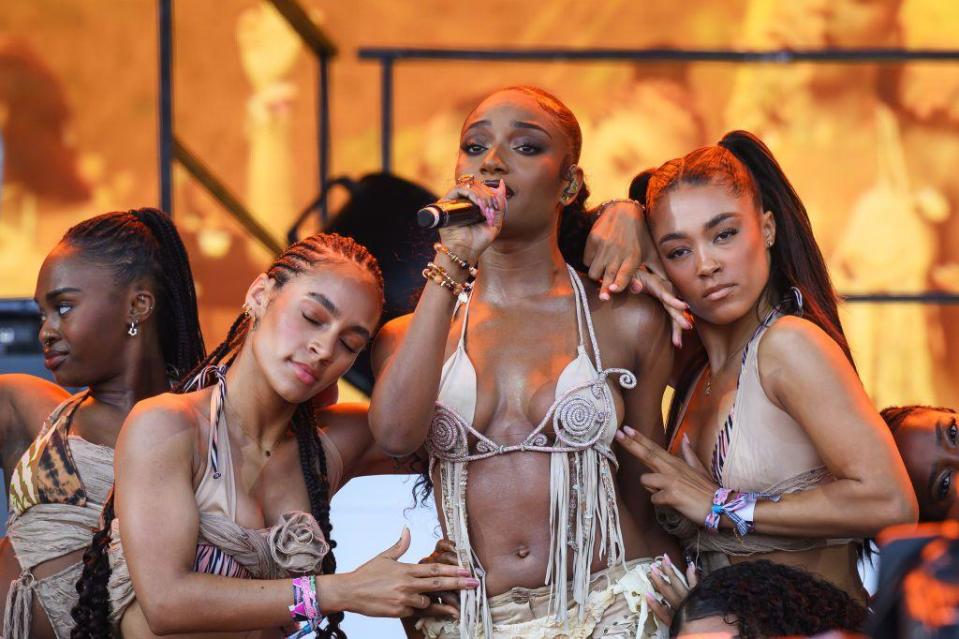  Nigerian artist Ayra Starr (C) performs on the Pyramid Stage during day four of Glastonbury Festival 2024 at Worthy Farm, Pilton on June 29, 2024 in Glastonbury, England. 