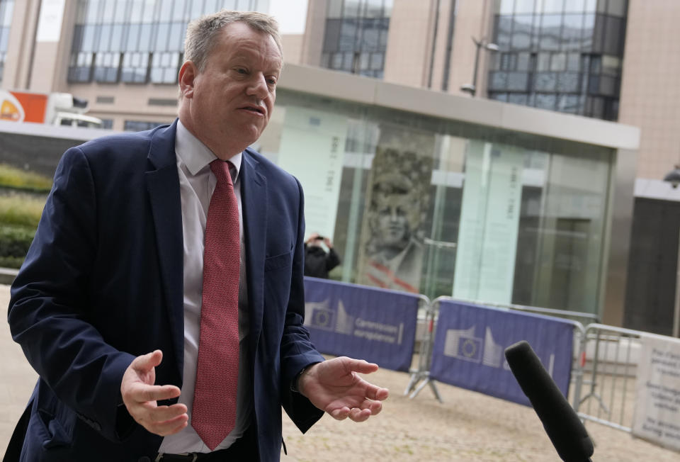 United Kingdom's Brexit negotiator Lord David Frost speaks with the media as he arrives for a lunch with European Commissioner for Inter-institutional Relations and Foresight Maros Sefcovic at EU headquarters in Brussels, Friday, Oct. 15, 2021. Brexit kicked into high gear again Friday, almost a year after a deal on a free trade agreement was supposed to have officially sealed the separation between the European Union and the United Kingdom. (AP Photo/Virginia Mayo)