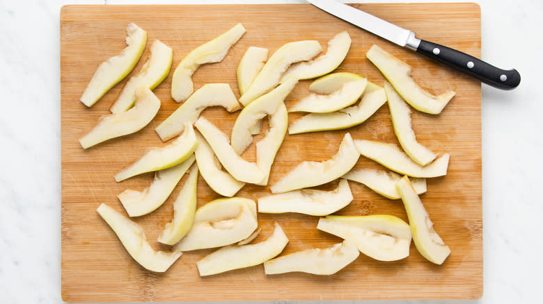 Sliced pears on cutting board