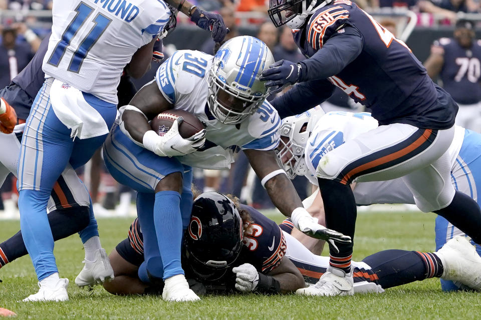 Detroit Lions running back Jamaal Williams carries the ball during the first half of an NFL football game against the Chicago Bears Sunday, Oct. 3, 2021, in Chicago. (AP Photo/David Banks)