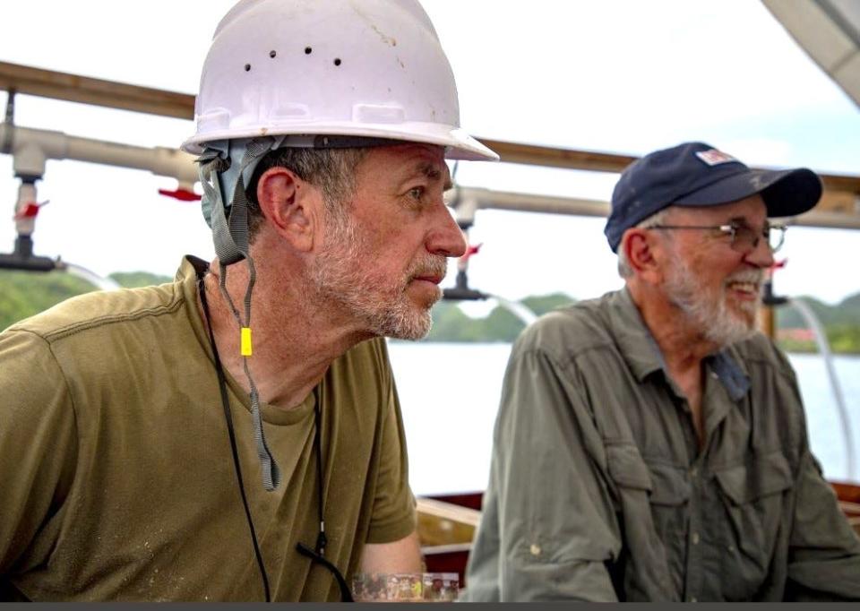 Stephen Mihm, left, with Patrick Scannon aboard a ship in the Pacific at the recovery site.