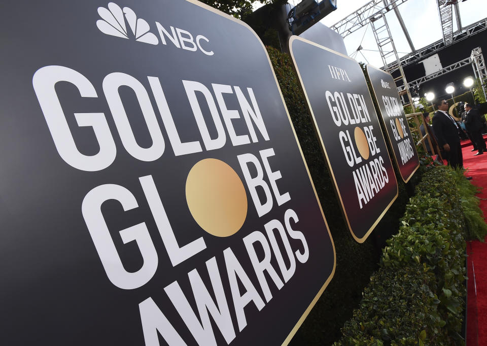 FILE - Event signage appears above the red carpet at the annual Golden Globe Awards, Sunday, Jan. 5, 2020, in Beverly Hills, Calif. (Photo by Jordan Strauss/Invision/AP, File)